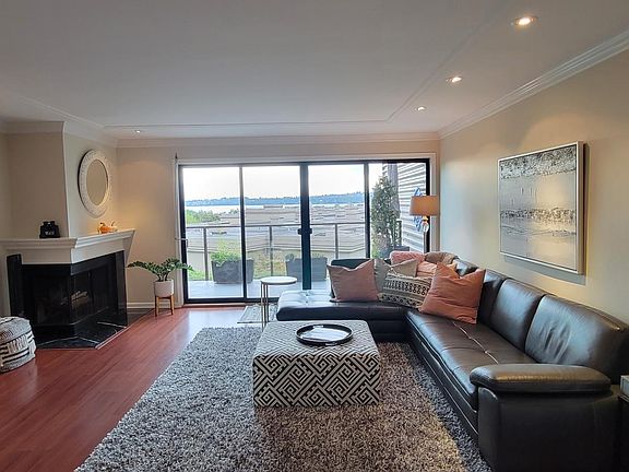 Wonderfully open feel , this is the living room looking out towards the view from the kitchen. Western exposure, lots of natural light.