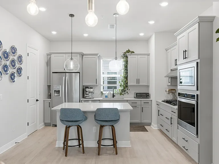 Kitchen with gas stove, in-wall oven, extra large island, and walk-in pantry