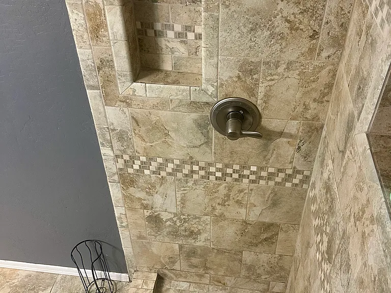 Tiled bathroom shower.