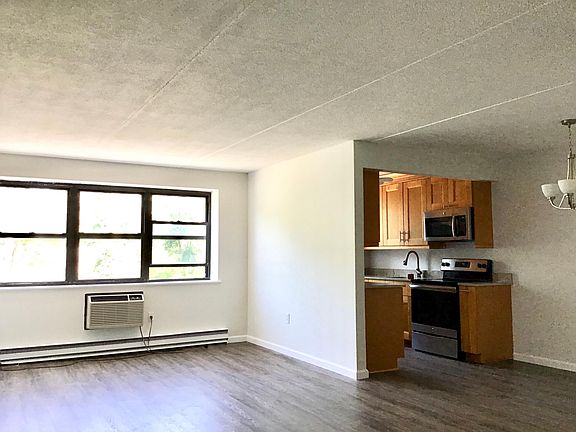 Living Room, Kitchen, and Dining Area.