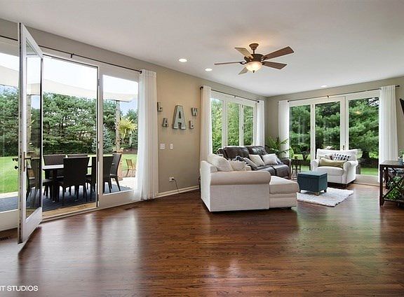 Bring the outdoors in! Enjoy this bright living space overlooking the beautifully landscaped, private yard.