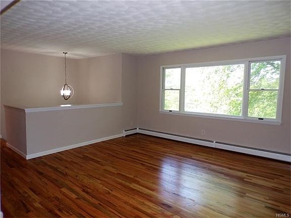 The living room is truly spacious and the new floor beautiful!!