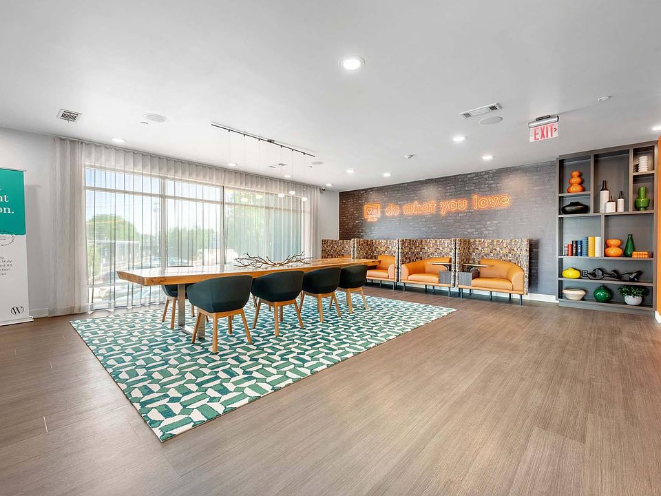 Gather around the dining table and booths, a versatile space for meals, work, or catching up with friends.