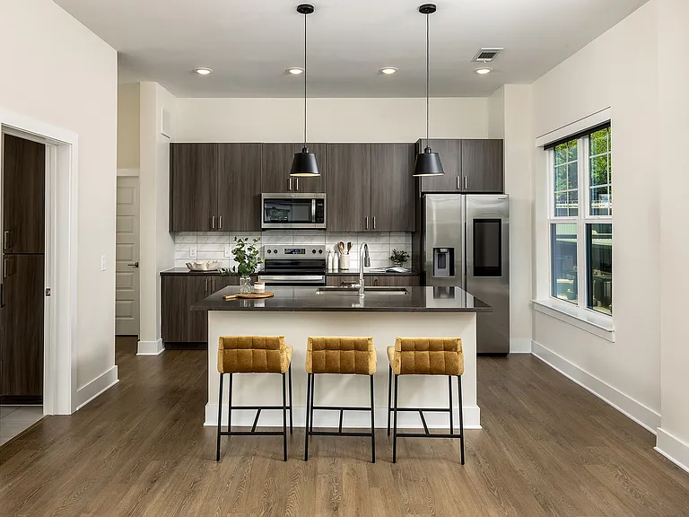 Gourmet kitchen with generous island and stainless smart refrigerator