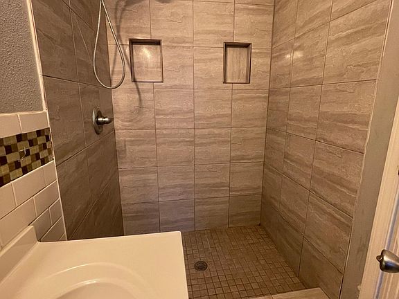 bathroom with stand in shower