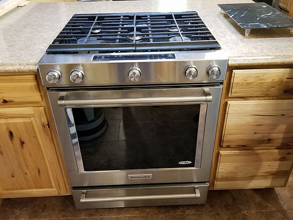 Across from dishwasher