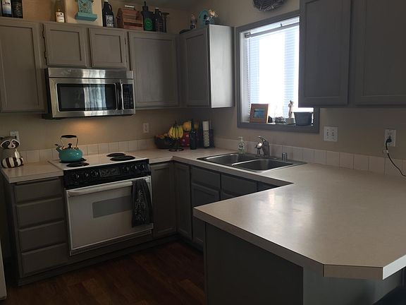 kitchen with dishwasher and large pantry area
