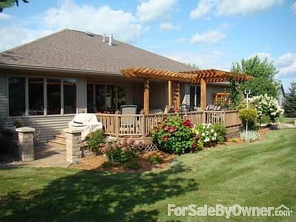 Trex Maintenance Free Deck 26 x 20 : Two Pergola on deck. Steps from either sides. Brick patio is a 