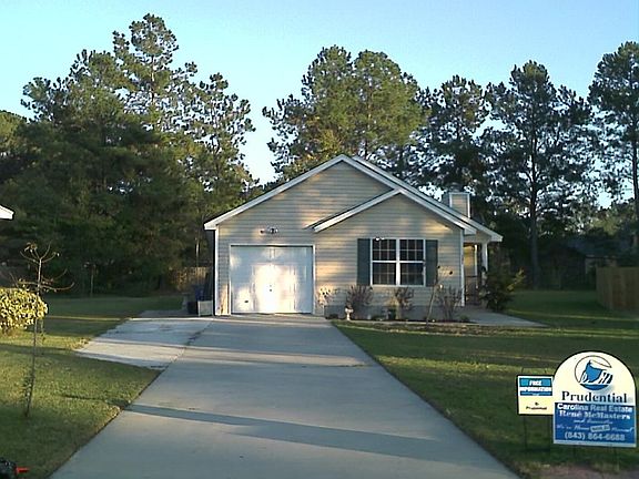 Look at this long, wide driveway, leading you to this beautiful home!