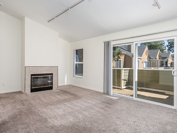 - High, vaulted ceilings 
- Freshly painted walls 
- Lots of natural light through the day
- Functional fireplace
- New carpeting
- Huge Balcony / Patio with extra storage