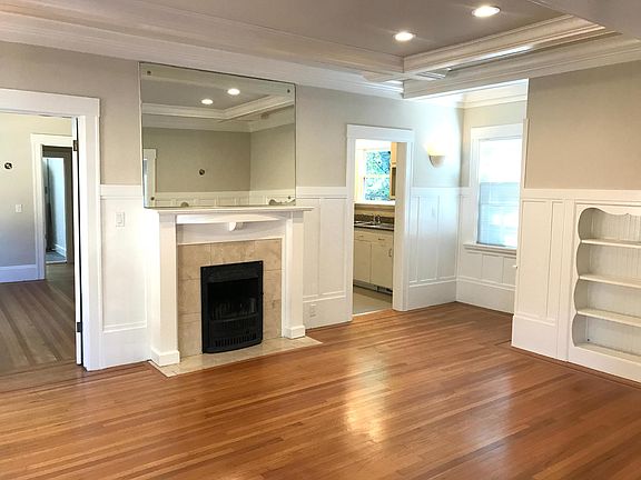 Formal dining room features fireplace