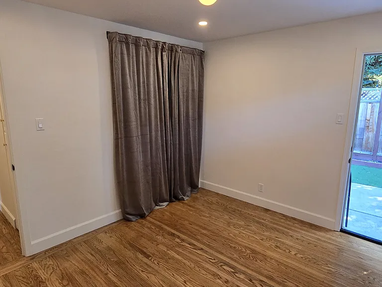 Master bedroom with views out to the private backyard.
