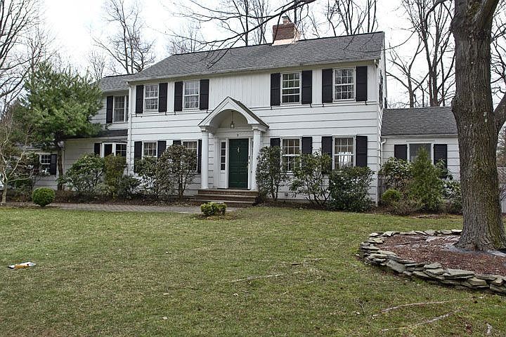 Classic Center Hall Colonial set on approx 1/2 acre level lot