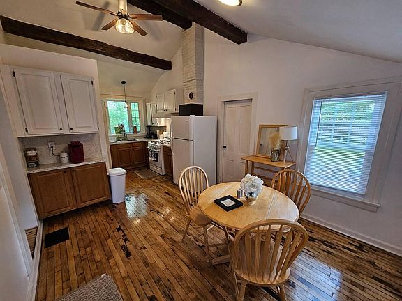 Vaulted ceiling in eat-in kitchen with beautiful wood beams