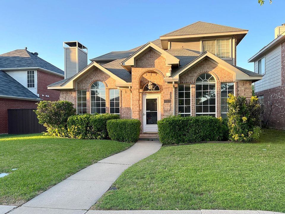 Beautiful drive up with landscaped yard