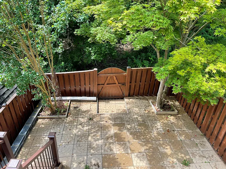 Patio view from deck, accessed from sliding glass doors in kitchen
