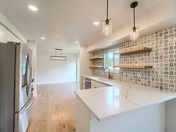 4th image of 9923 E Exposition Ave