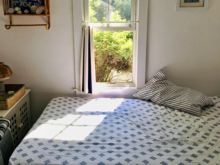 Full size wooden platform bed with bamboo mattress and 12 inches of space below for added storage, 2 large closets and a smaller one for linens.
