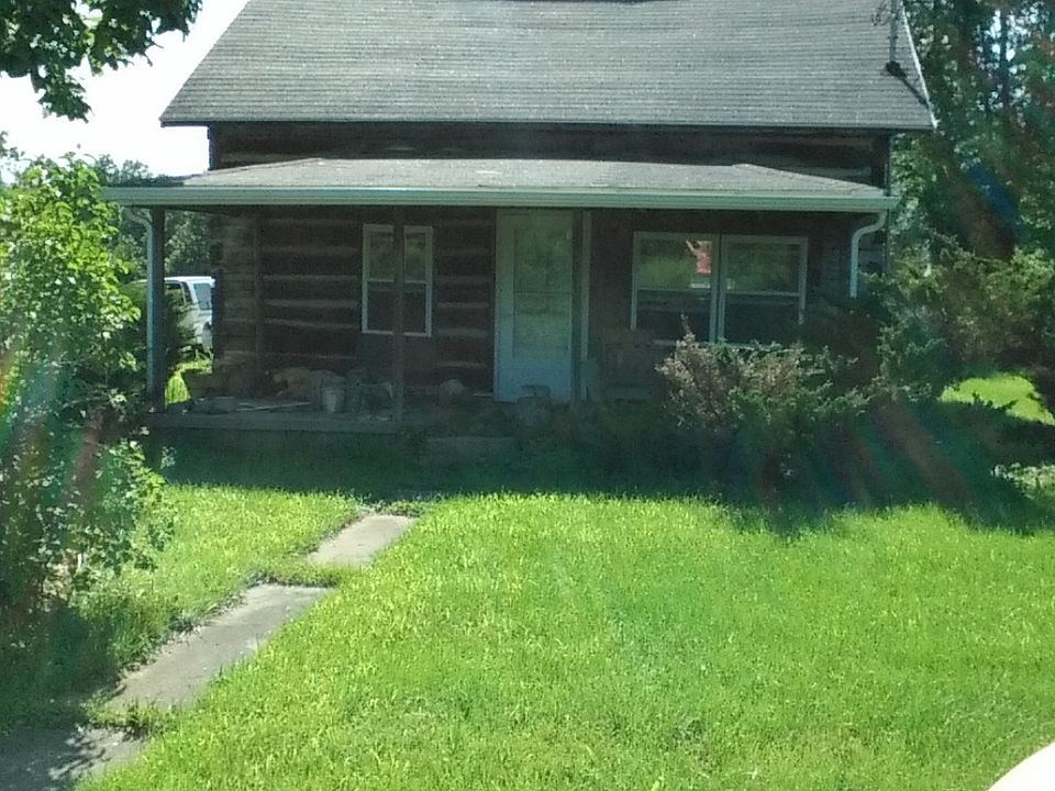 front of cabin/road view