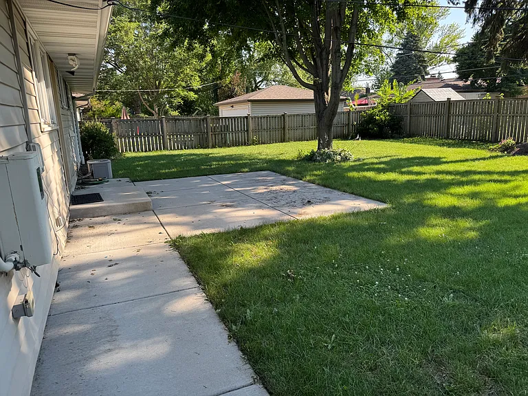 Back yard with concrete patio