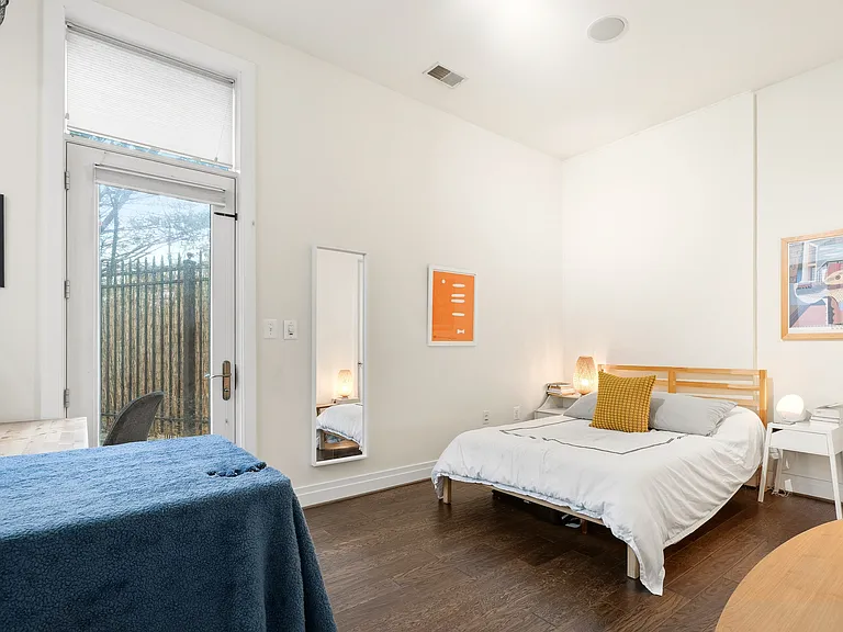 Sunlit Bedroom with Large Windows