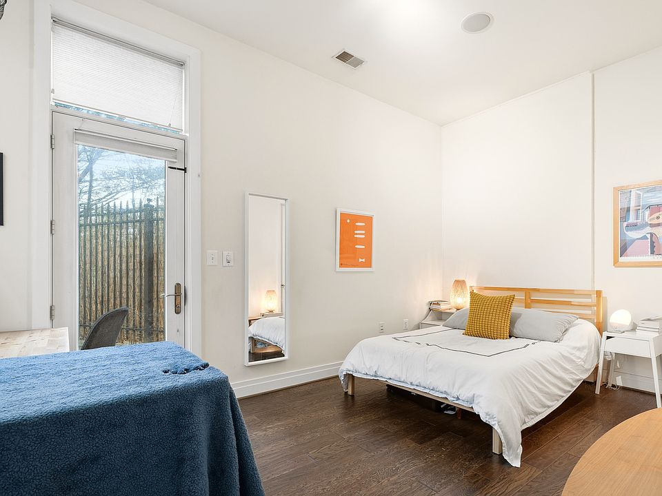 Sunlit Bedroom with Large Windows