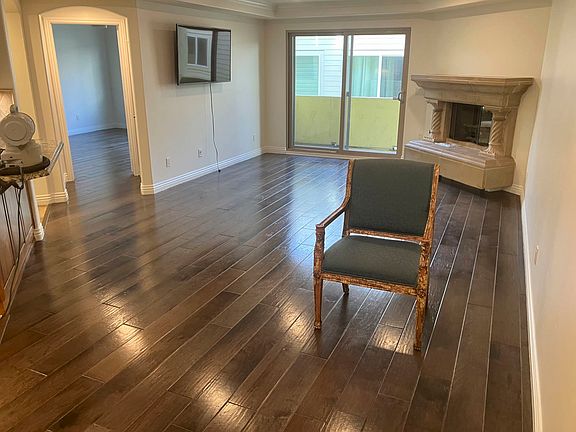 The great room. TV included, if you want it. Kitchen to the far left. Entry to the master bedroom next, balcony in the middle, the fireplace.