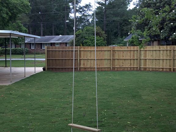 High swing in the backyard ensures that the children will always have fun!!
