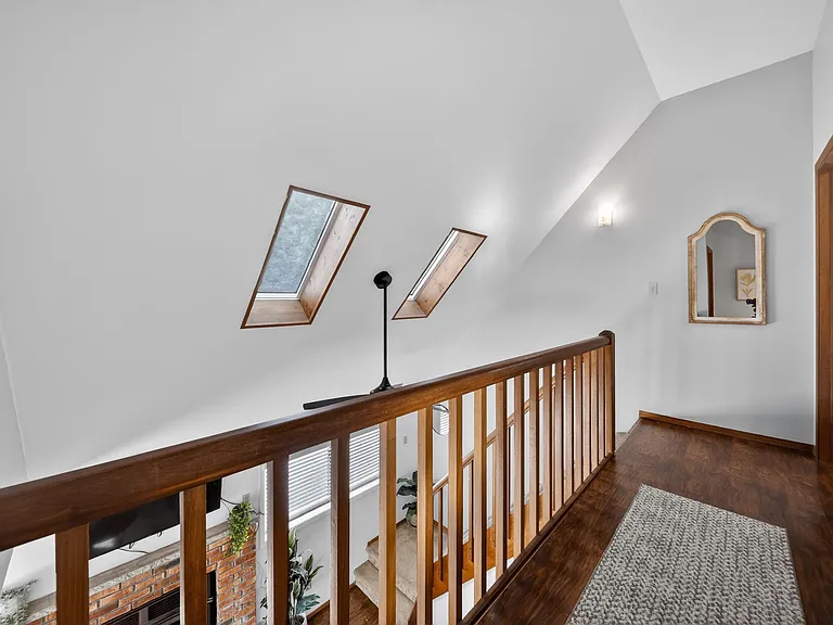 Bright Upstairs Hallway _ Open loft-style hallway with skylights that fill the space with natural light.