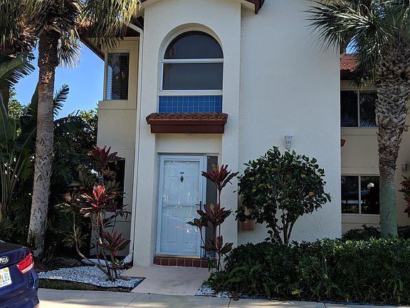 Private entrance with parking awning carport