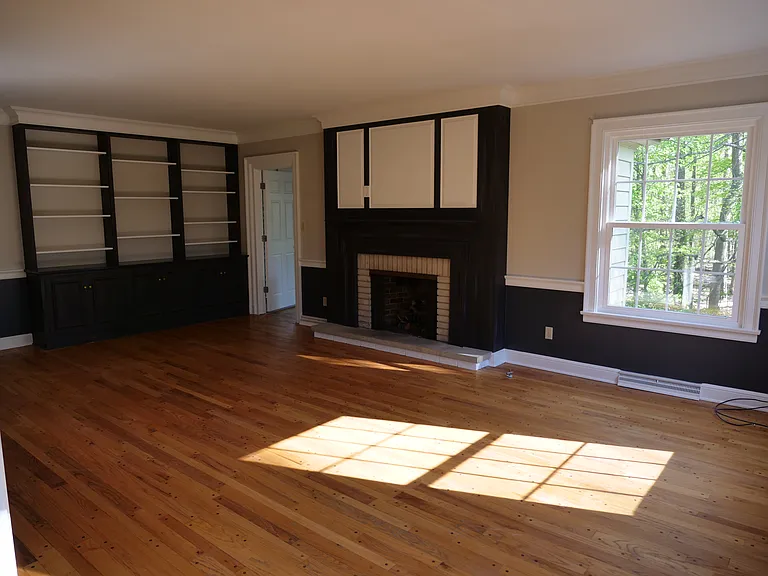Large living room with gas fireplace and beautiful view of Mill Creek Park.