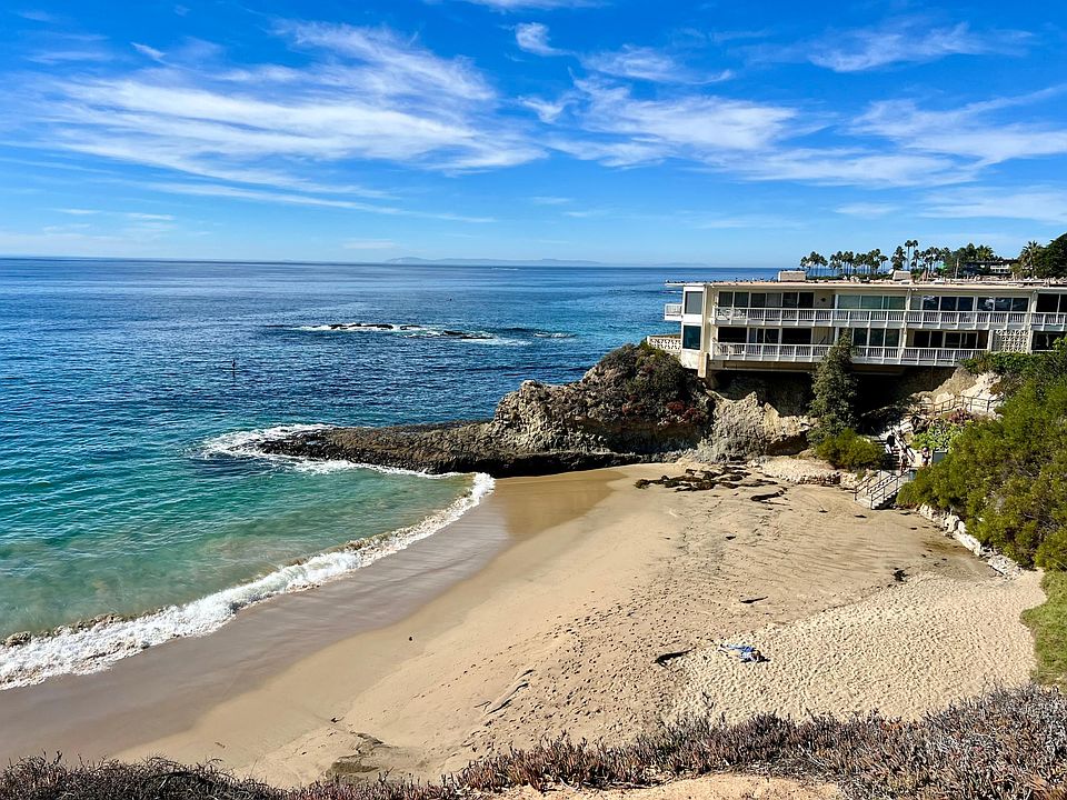 Oceanfront complex situated at the North end of beautiful Heisler Park. This two level Condo is private (no one above or below!) with an elevated panoramic view of the Coastline and Fisherman_s Cove.