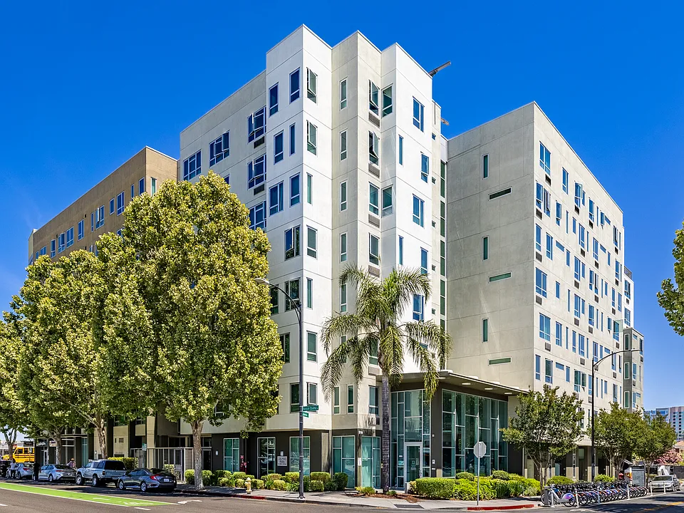 Modern urban living surrounded by tree-lined streets and vibrant city energy.