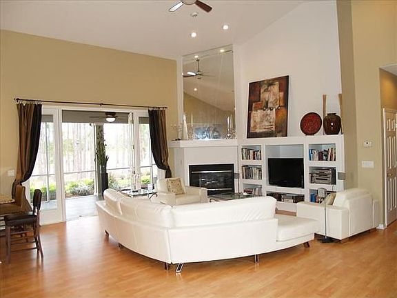 Great Room with sweeping outdoor view, fireplace and media niches.