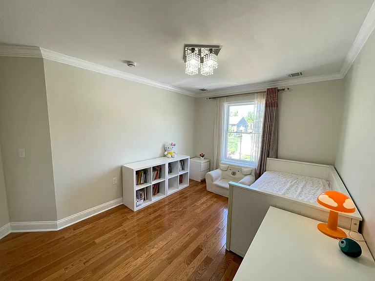Spacious third bedroom ideal for guests, office, or nursery
