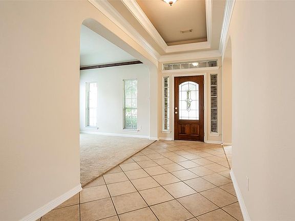 High Coffered Ceilings in the Entryway as you view towards the Study.