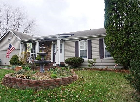 This house has curb appeal! Soon the flowers will be in bloom.