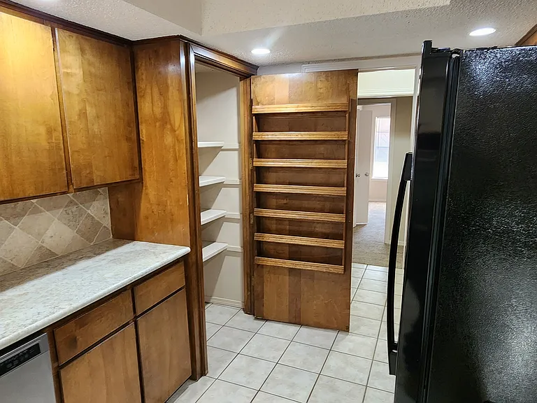 CHECK OUT THIS GREAT PANTRY! BRING IN THE GROCERIES FROM THE GARAGE, THROUGH THE LAUNDRY ROOM TO RACK AND STACK THEM IN THE PANTRY.