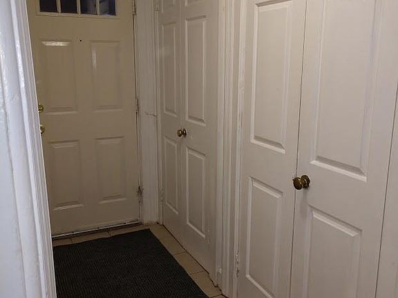 Private hallway entrance with coat closet. Dedicated Ring security system for apartment.