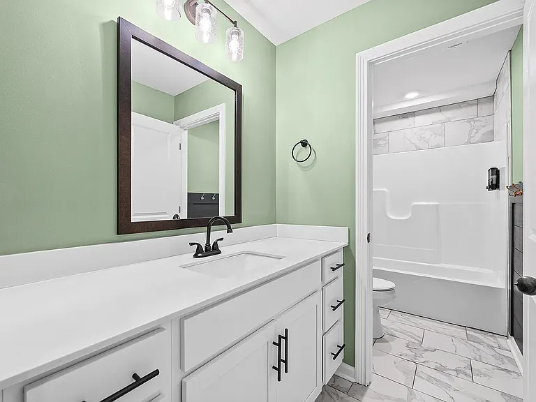 Full bathroom, second door to toilet and shower