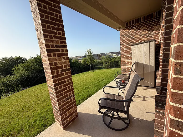 Right side view of private back patio overlooking greenbelt line