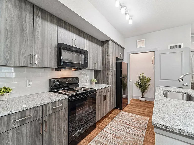 Experience stylish living with a modern all-electric kitchen at The Broadway in Houston.