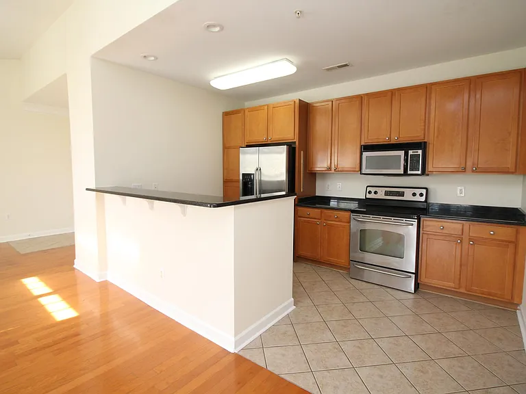 Kitchen with stainless appliances and tile flooring