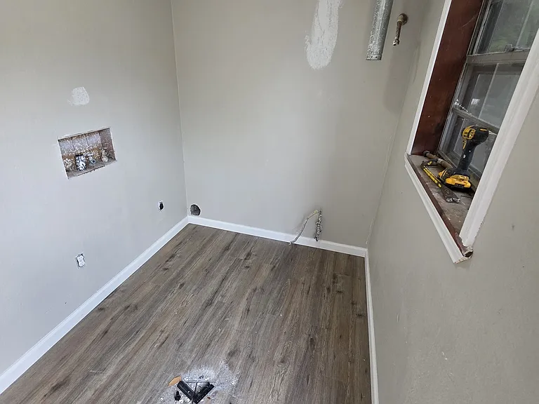 The utility room will have a new water heater and connections for washer/dryer.