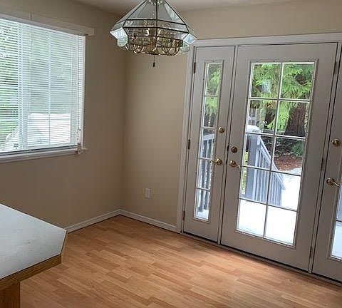 Kitchen eating area along with a bar stool counter.
