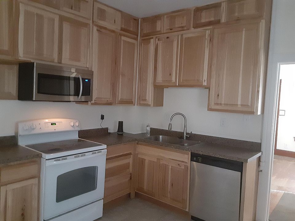 Kitchen with new appliances, new wood cabinets.