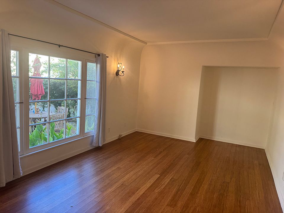 Bamboo wood floors and courtyard window. All wall sconces are on dimmers.