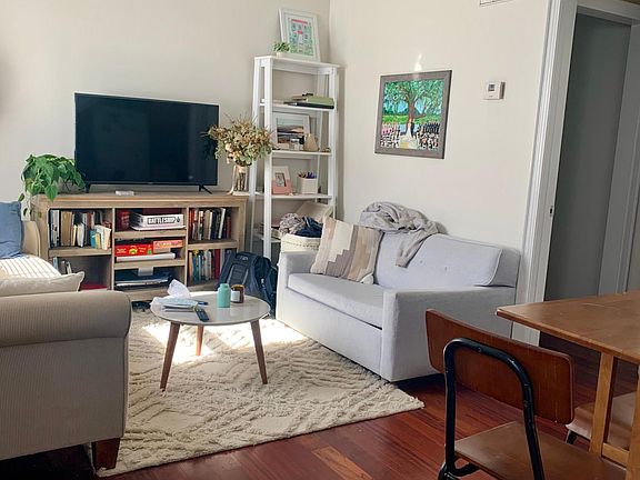 First floor view from stairs to 2nd level. Brazilian Cherry hardwoods in living rm, kitchen, 1/2 bath.