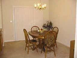 Dining and living areas are open and bright..