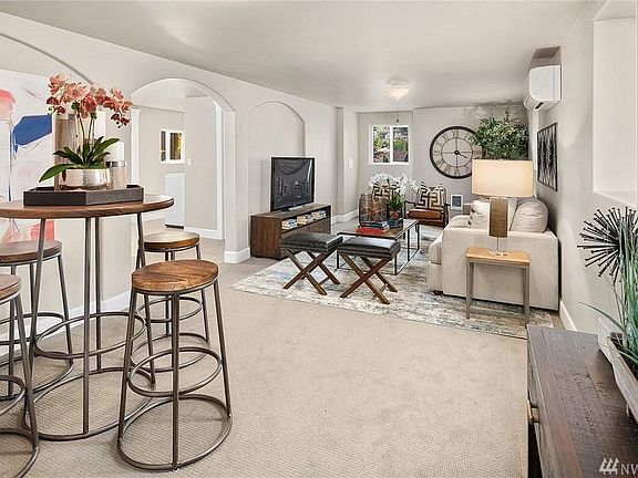 Living Room - Unit has A/C and in-wall electric heating. Fresh paint throughout unit.